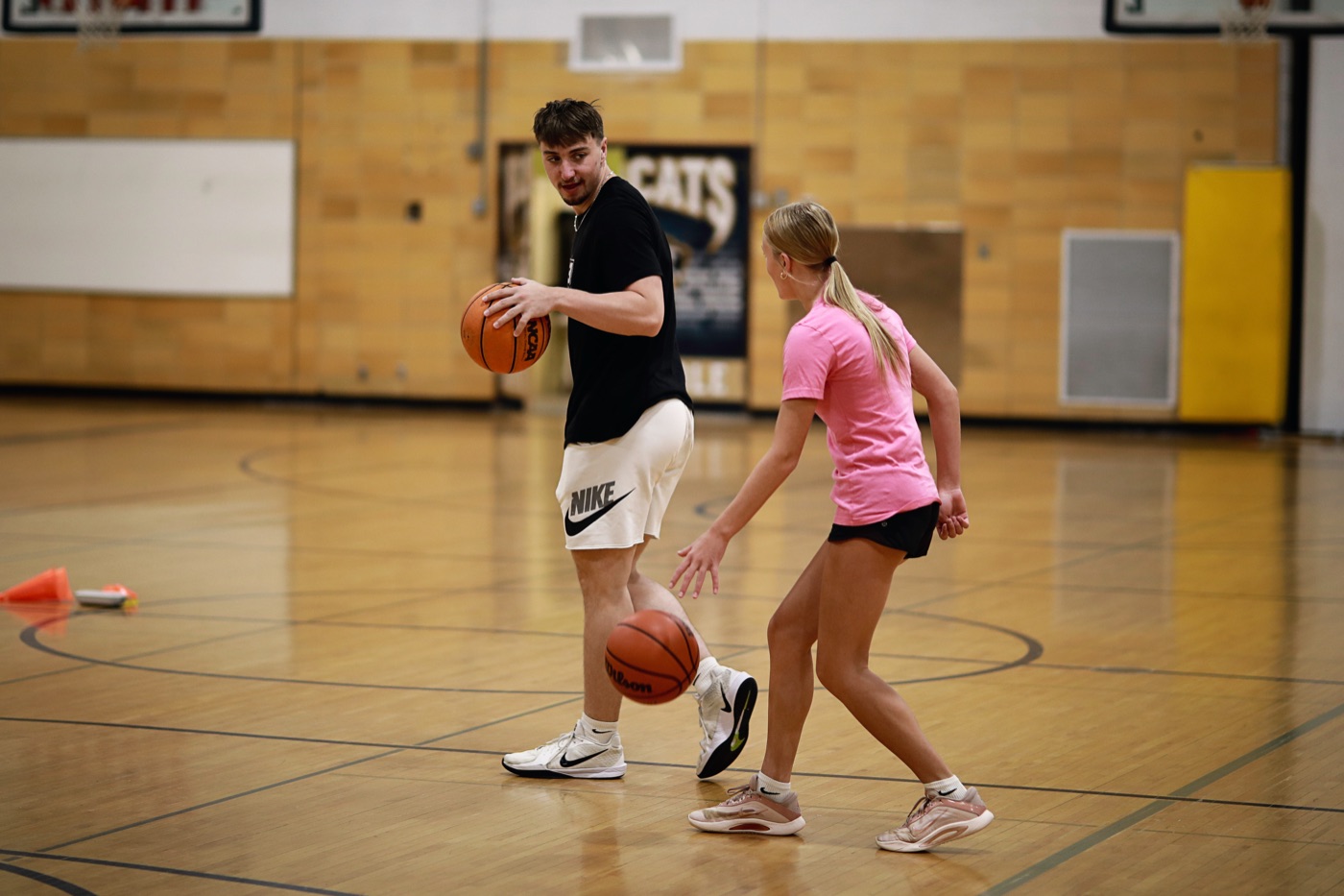 Zac working one-on-one with a young player
